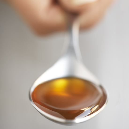 Pure Honey Served On A Spoon